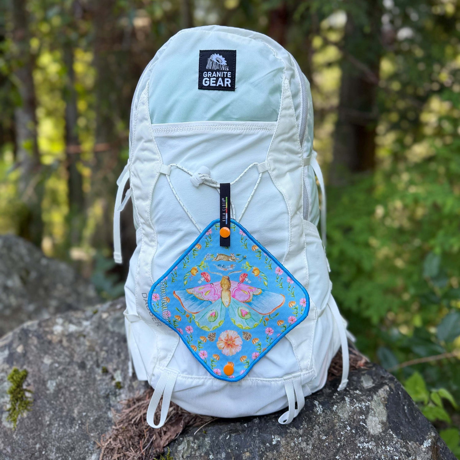 colorful pee cloth on backpack