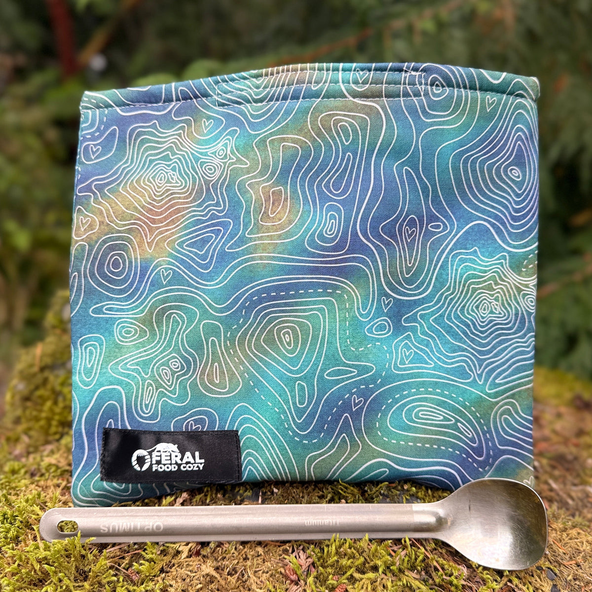 a  teal insulated food cozy 