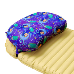 Ultralight backpacking pillow strap securing a camp pillow to a sleeping pad