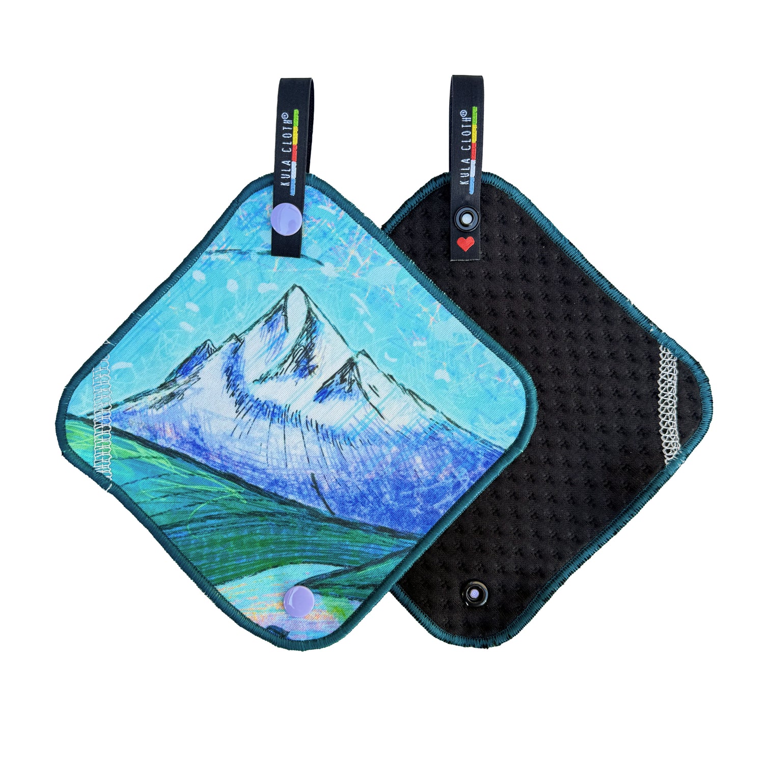 2 Kula Cloths -- the front of one is visible with a mountain painting and the backside of the other one is visible, displaying soft, absorbent dimpled fabric.
