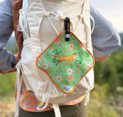 reusable fox and flower pee cloth design snapped to backpack outside