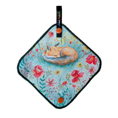 A diamond-shaped fabric towel or cloth featuring an illustration of a sleeping fox in a field of flowers, with a black hanging tab at the top.